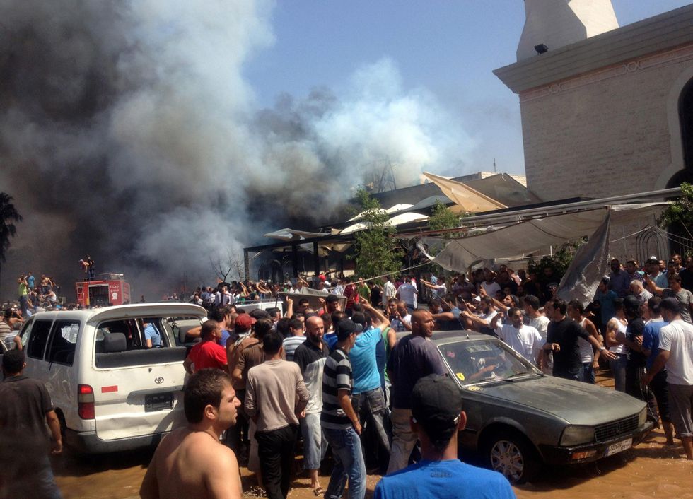 Le bombe a Tripoli, Libano, e altre foto del giorno, 23.8.13