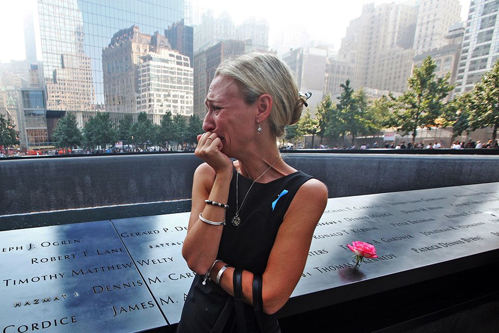 Lacrime a Ground Zero e altre foto del giorno, 11.9.2013