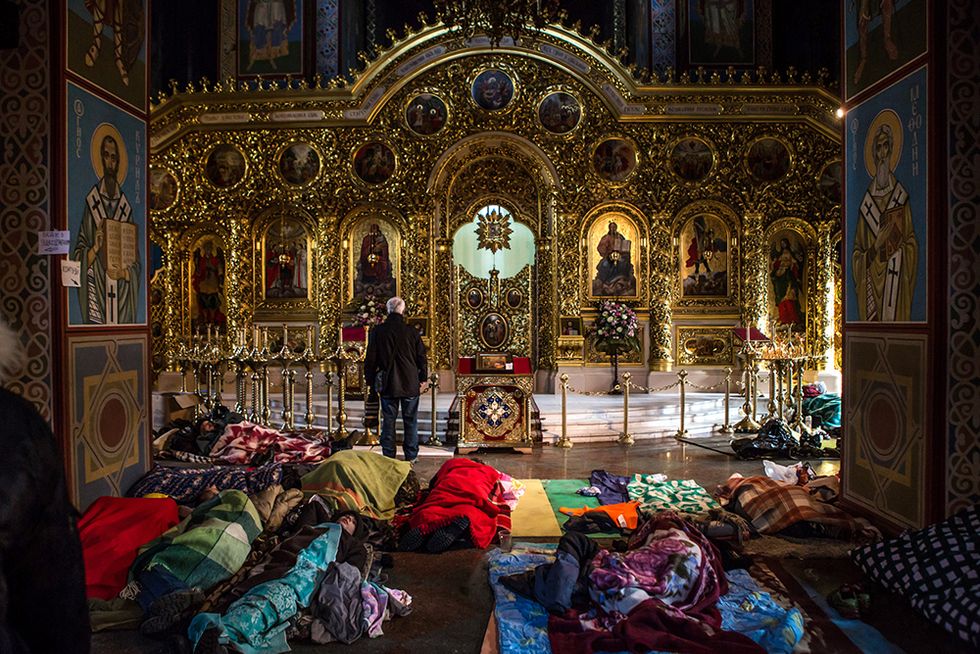 Sacchi a pelo nella cattedrale a Kiev e altre foto del giorno, 19.2.2014