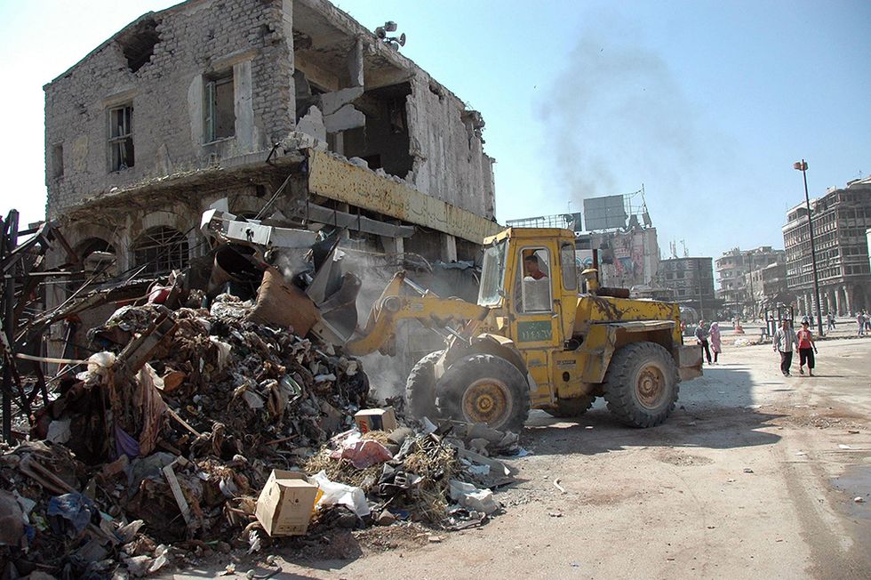 Le macerie di Homs e altre foto del giorno, 12.05.2014