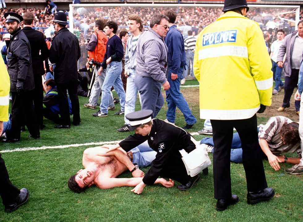 Policemen rescue soccer fans at Hillsborough stadi